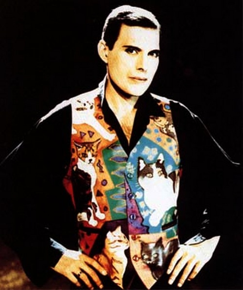 Former Queen Frontman, the late Freddie Mercury, wearing a waistcoat with many cats on it.